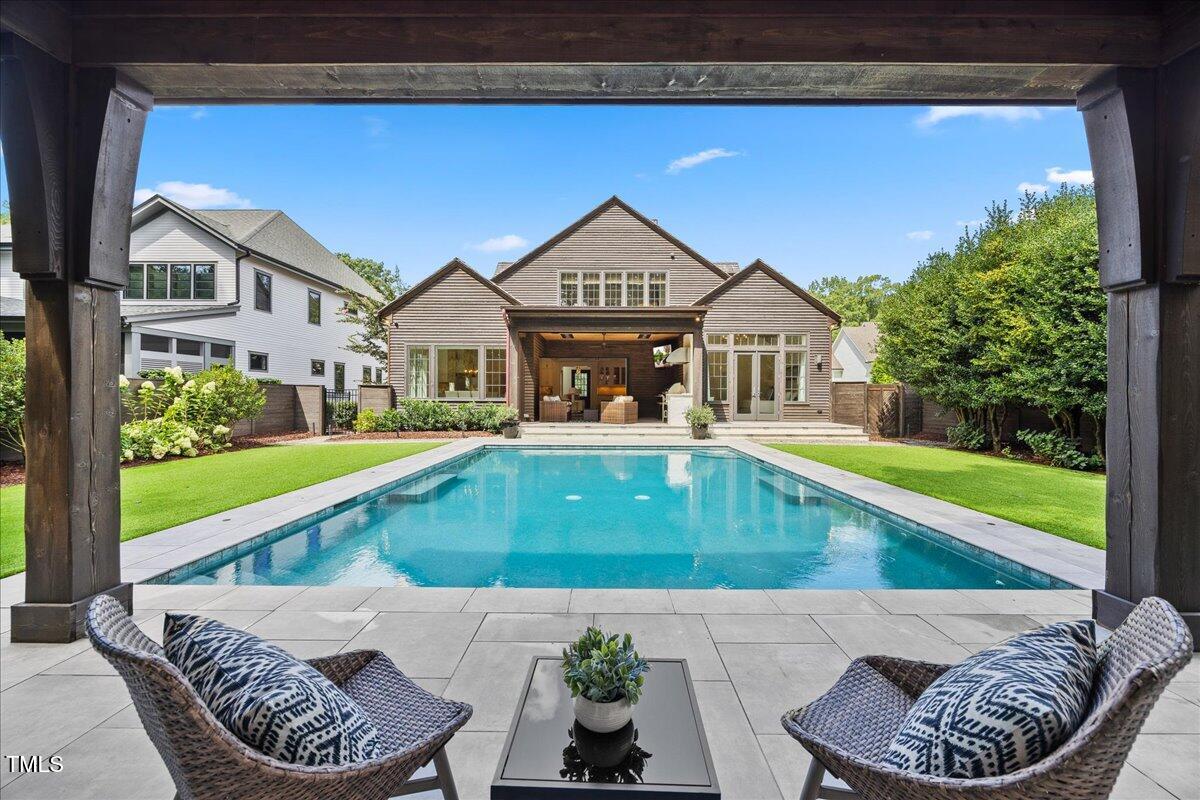 2120 Kipawa Street Raleigh, NC 27607 - Photo 3 of 77 a view of a house with a swimming pool and a yard