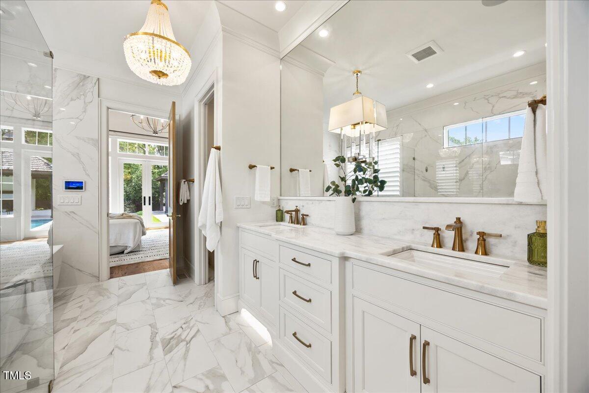 2120 Kipawa Street Raleigh, NC 27607 - Photo 31 of 77 a bathroom with a sink mirror and a shower