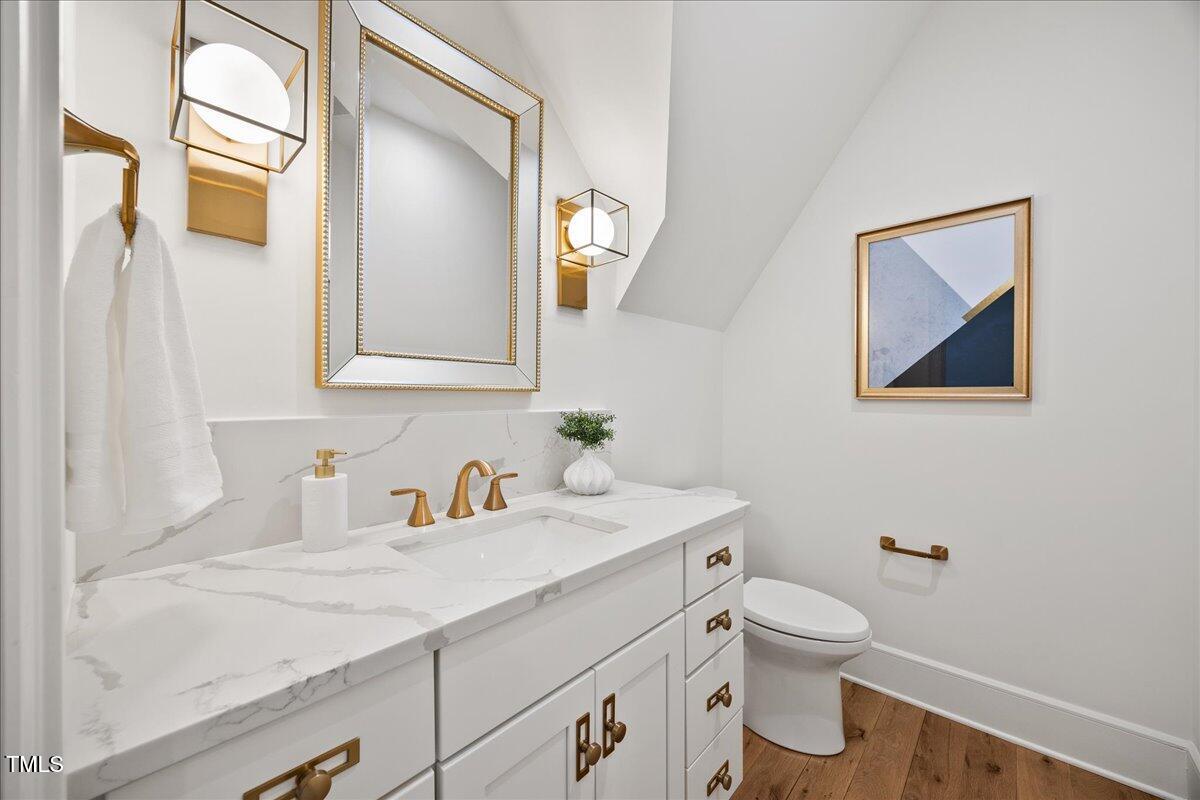 2120 Kipawa Street Raleigh, NC 27607 - Photo 40 of 77 a bathroom with a sink and a toilet