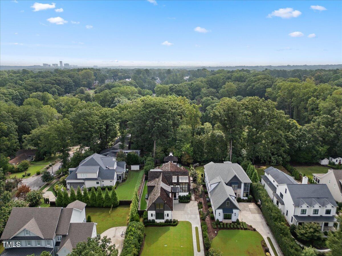 2120 Kipawa Street Raleigh, NC 27607 - Photo 67 of 77 an aerial view of a house with swimming pool and a garden