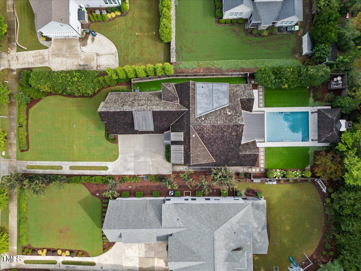 2120 Kipawa Street Raleigh, NC 27607 - Photo 68 of 77 an aerial view of a house with a garden and swimming pool