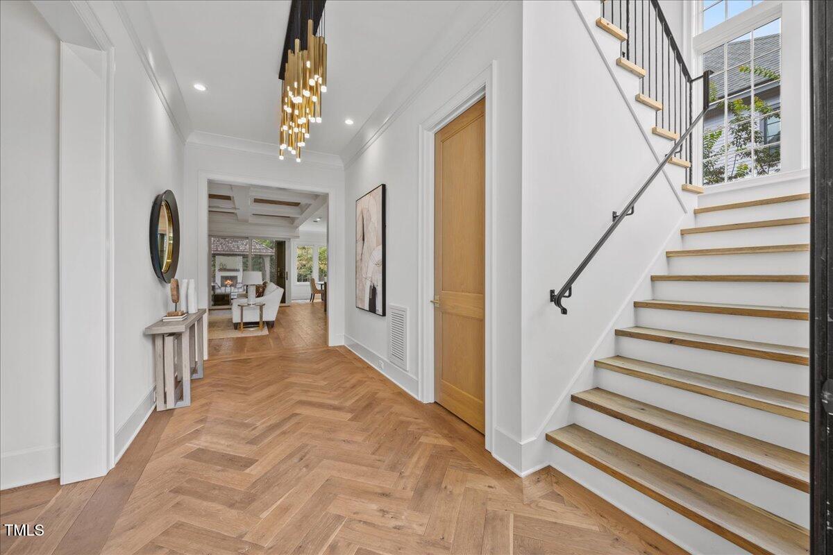 2120 Kipawa Street Raleigh, NC 27607 - Photo 7 of 77 a view of entryway and hall with wooden floor