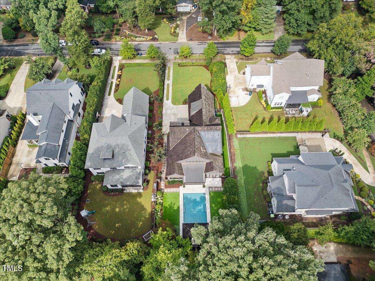 2120 Kipawa Street Raleigh, NC 27607 - Photo 76 of 77 an aerial view of residential house with outdoor space and parking