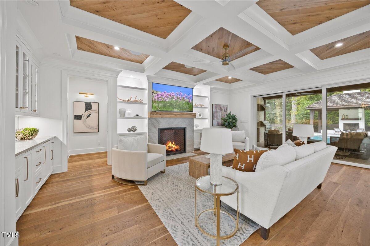 2120 Kipawa Street Raleigh, NC 27607 - Photo 8 of 77 a living room with furniture fireplace and a large window