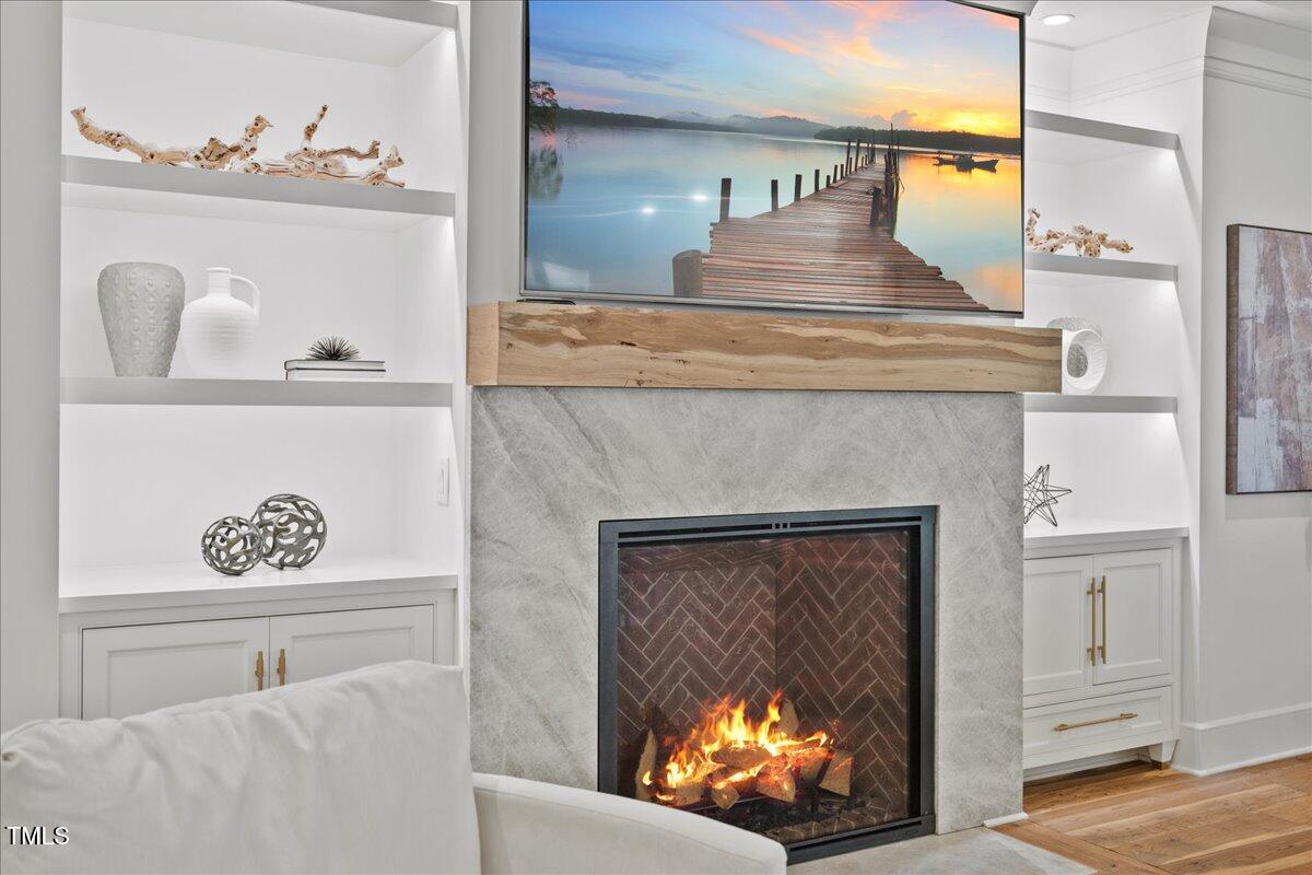 2120 Kipawa Street Raleigh, NC 27607 - Photo 9 of 77 a living room with furniture and a fireplace