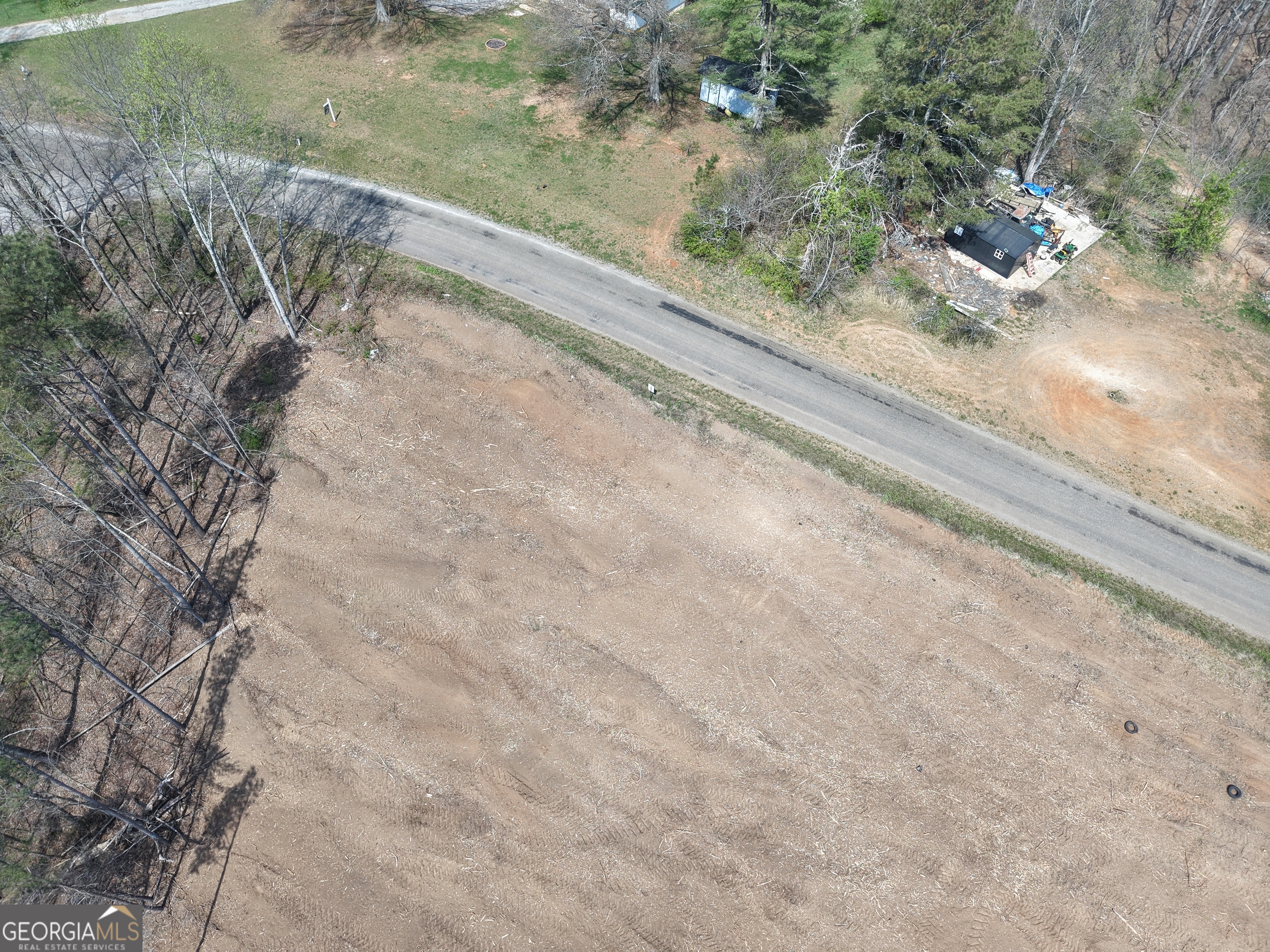 0 Young Loop, Unit 7206 PARCEL C Fairmount, GA 30139 - Photo 17 of 46 a view of a yard with wooden floor
