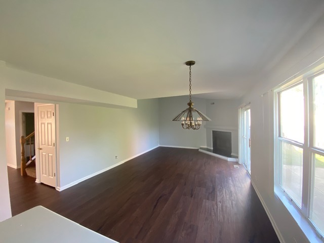 209 North Southport Road Mundelein, IL 60060 - Photo 6 of 18 a view of an empty room with wooden floor and a window