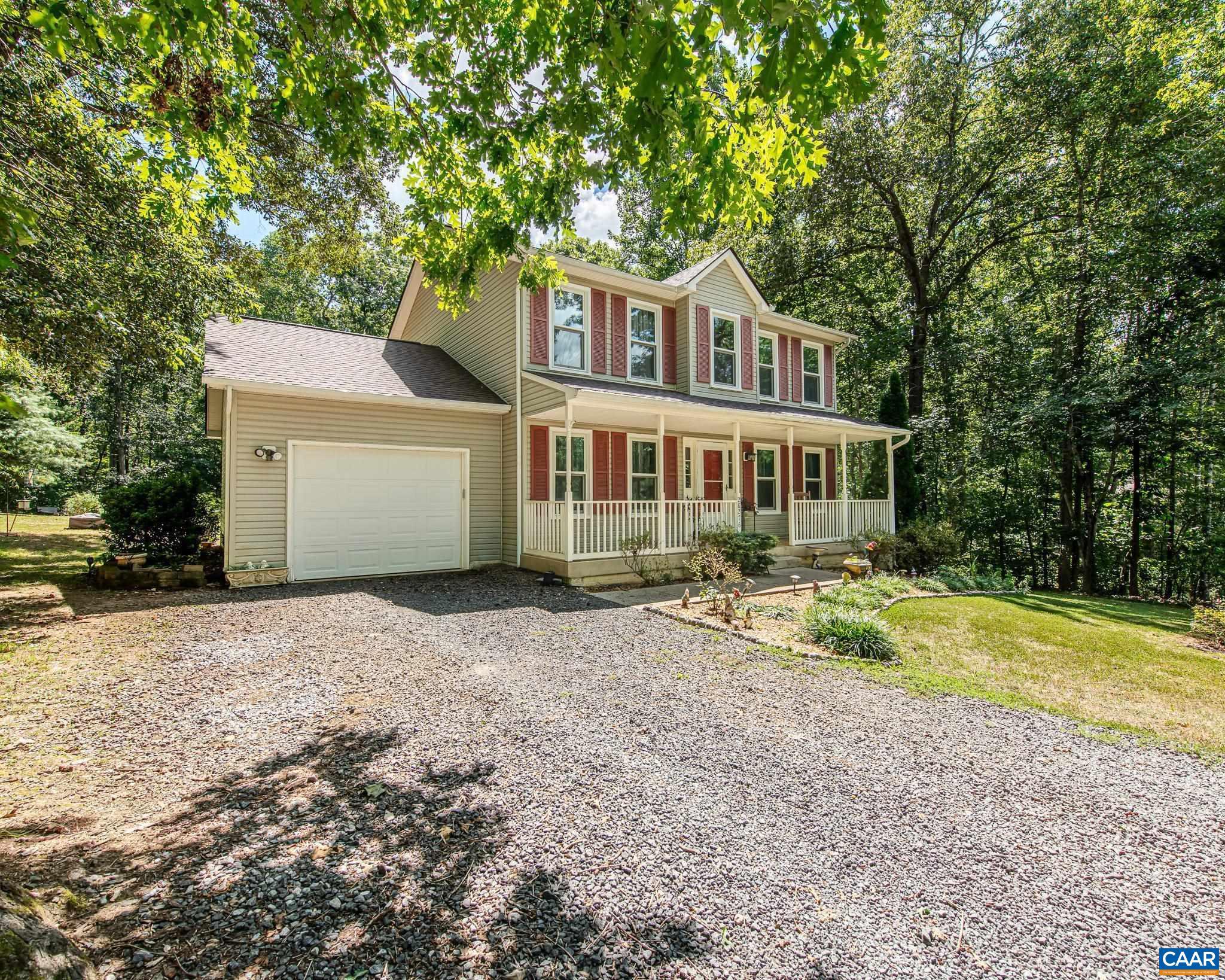 28276 Walnut Ridge Way Rhoadesville, VA 22542 - Photo 1 of 37 a front view of a house with a yard and garage