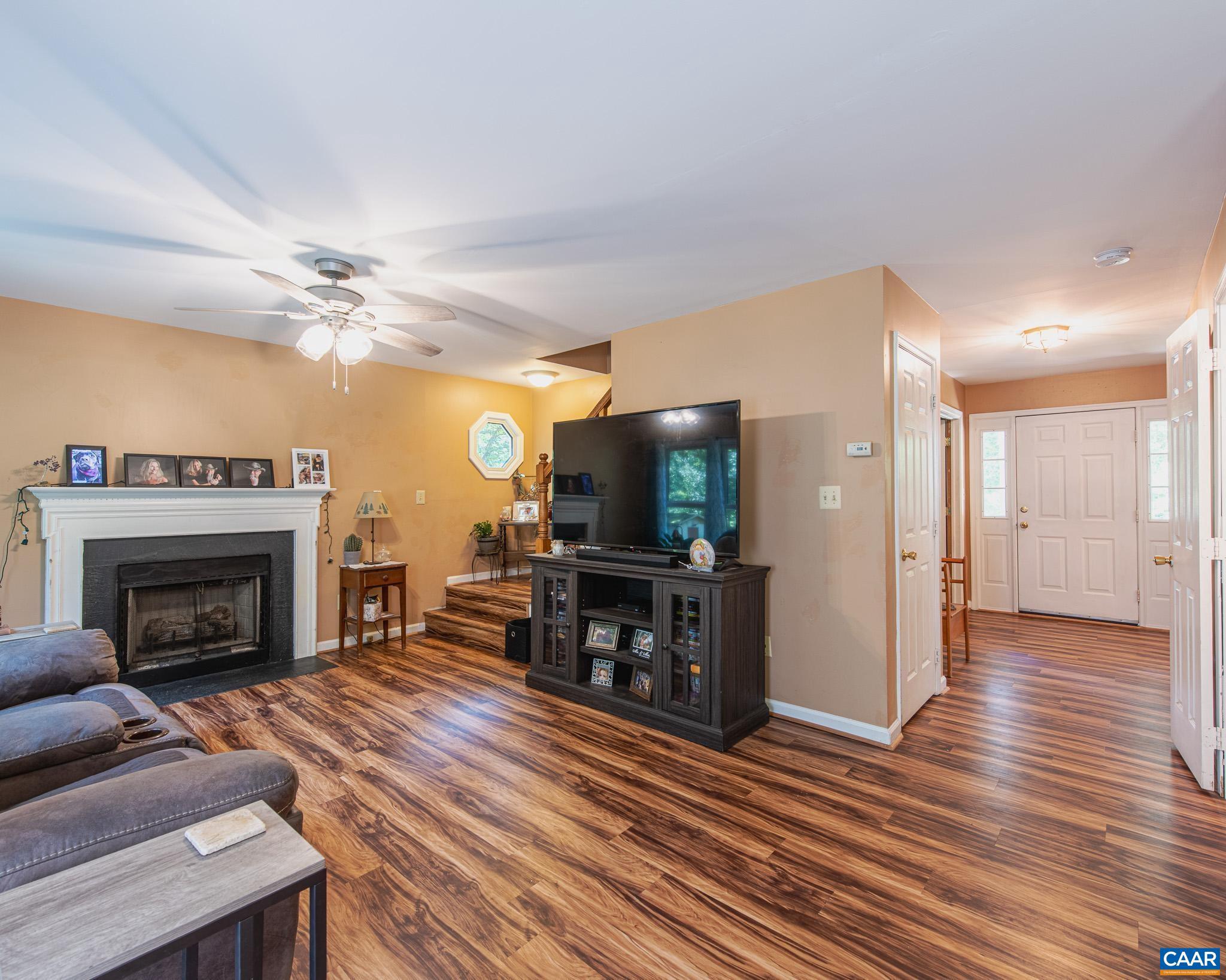 28276 Walnut Ridge Way Rhoadesville, VA 22542 - Photo 12 of 37 a living room with furniture and a fireplace
