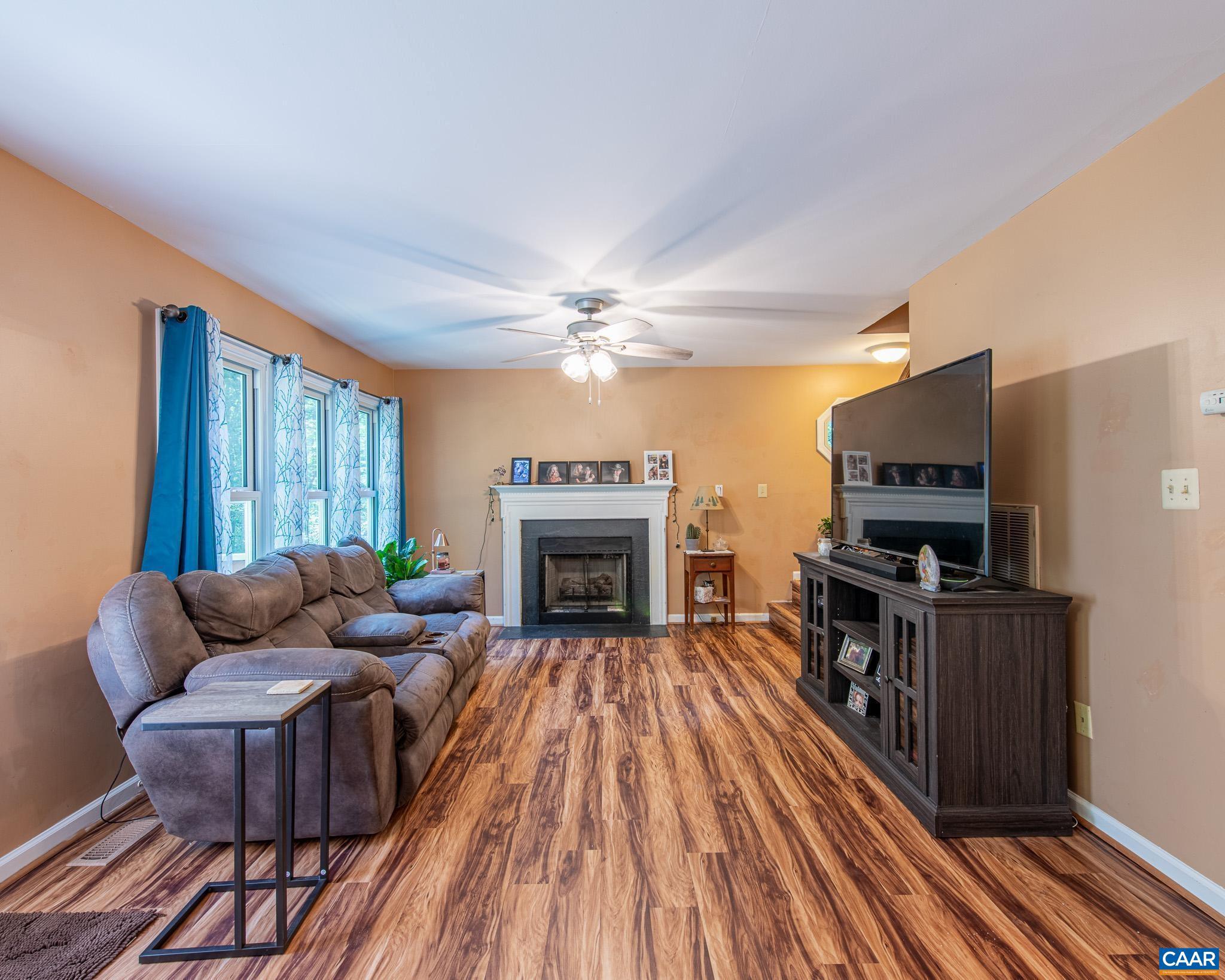 28276 Walnut Ridge Way Rhoadesville, VA 22542 - Photo 13 of 37 a living room with furniture and a fireplace