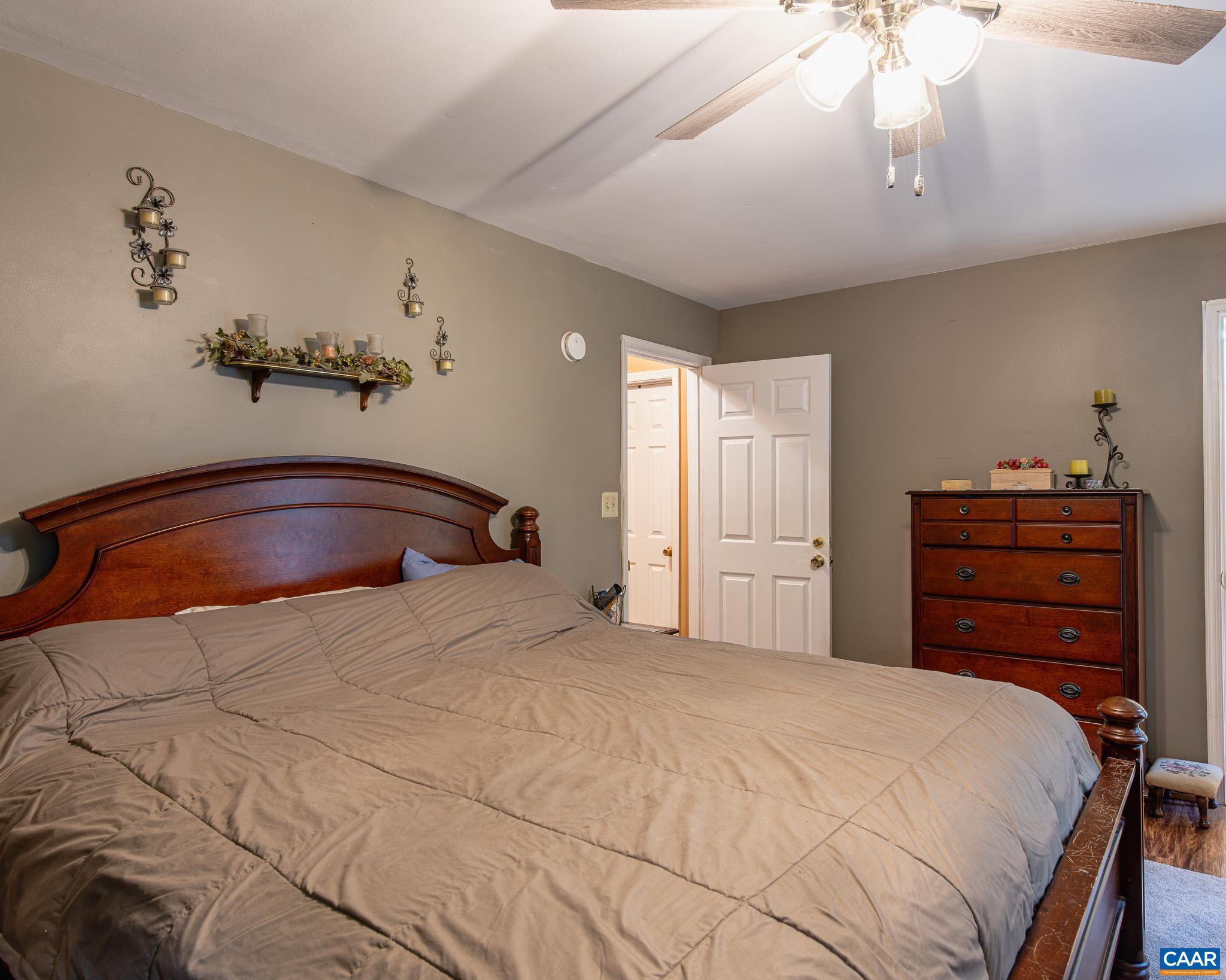 28276 Walnut Ridge Way Rhoadesville, VA 22542 - Photo 20 of 37 a bedroom with a bed and a dresser