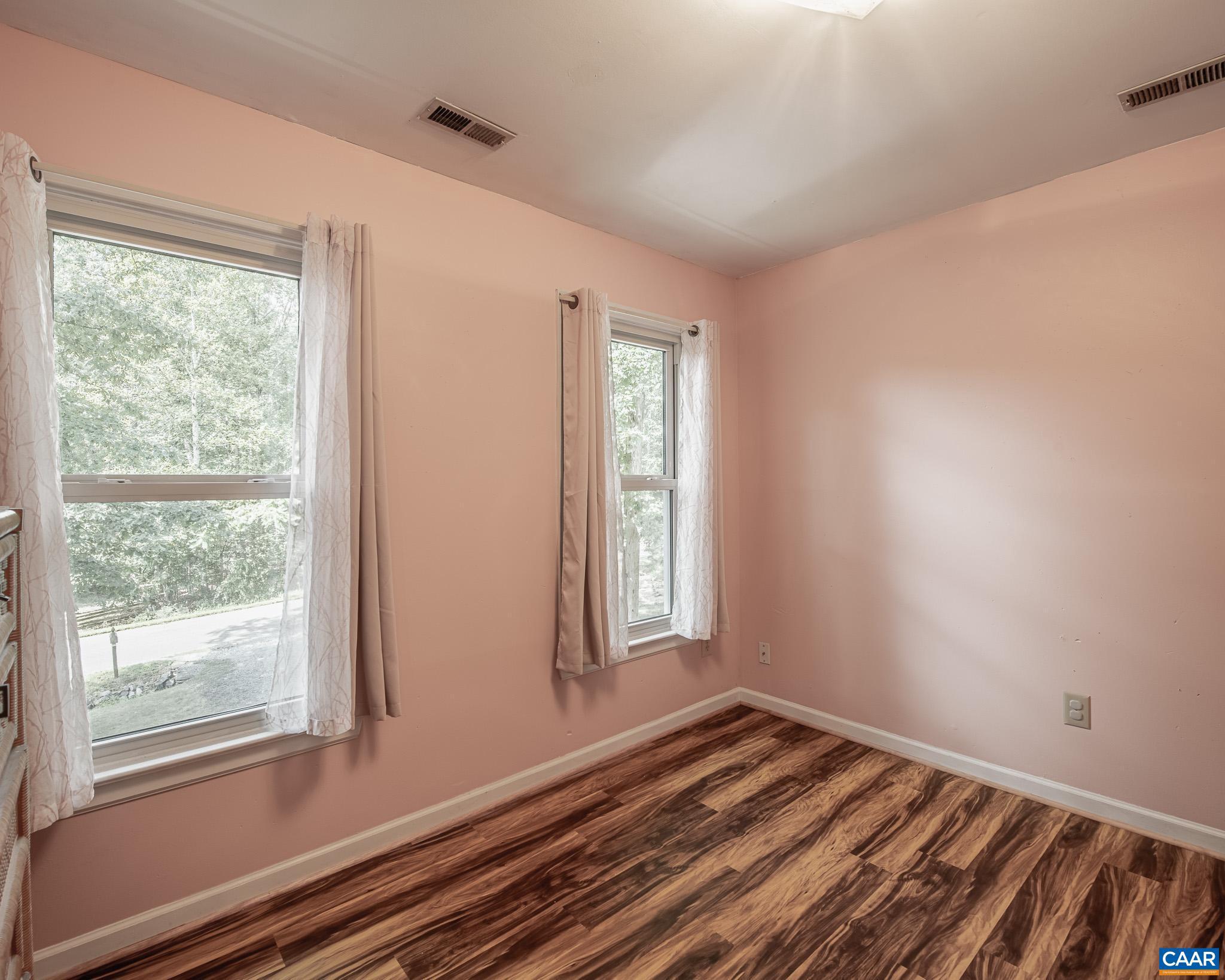 28276 Walnut Ridge Way Rhoadesville, VA 22542 - Photo 23 of 37 a view of a room with wooden floor and windows