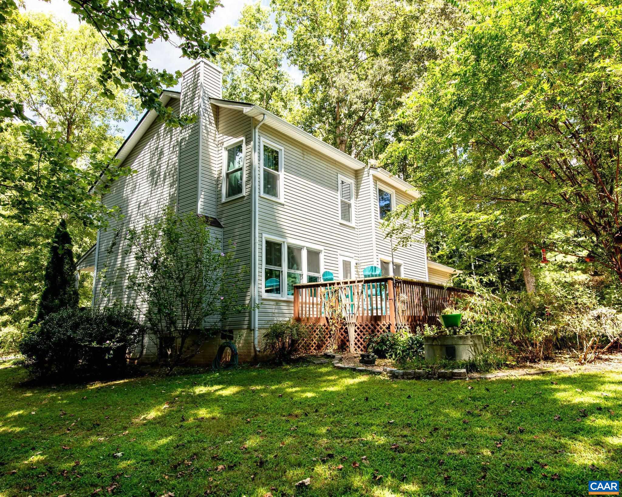 28276 Walnut Ridge Way Rhoadesville, VA 22542 - Photo 26 of 37 a front view of a house with garden