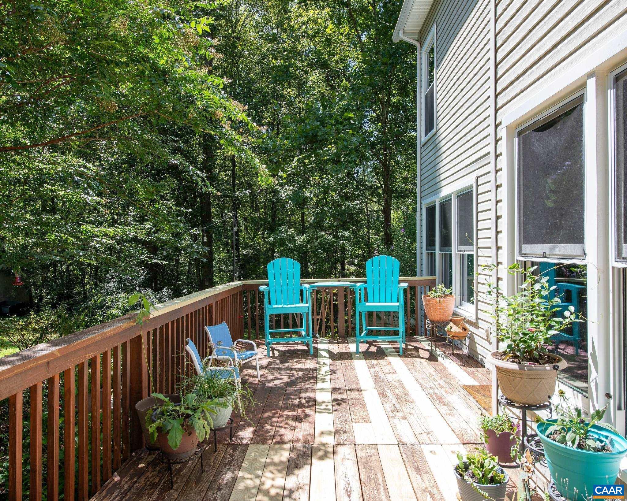 28276 Walnut Ridge Way Rhoadesville, VA 22542 - Photo 28 of 37 a balcony with wooden floor table and chairs