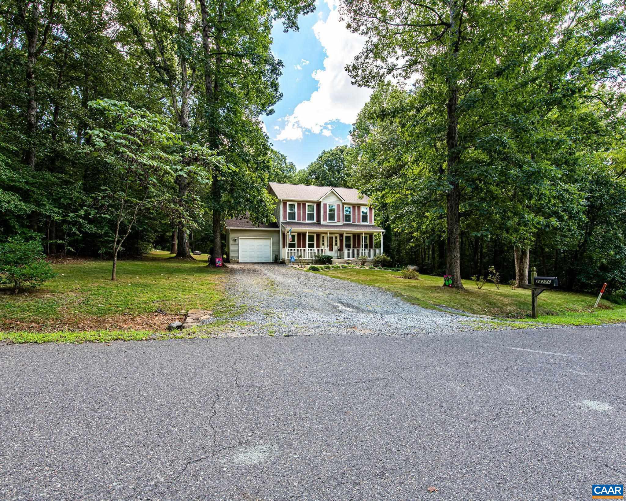 28276 Walnut Ridge Way Rhoadesville, VA 22542 - Photo 34 of 37 a view of a house with a big yard and large trees