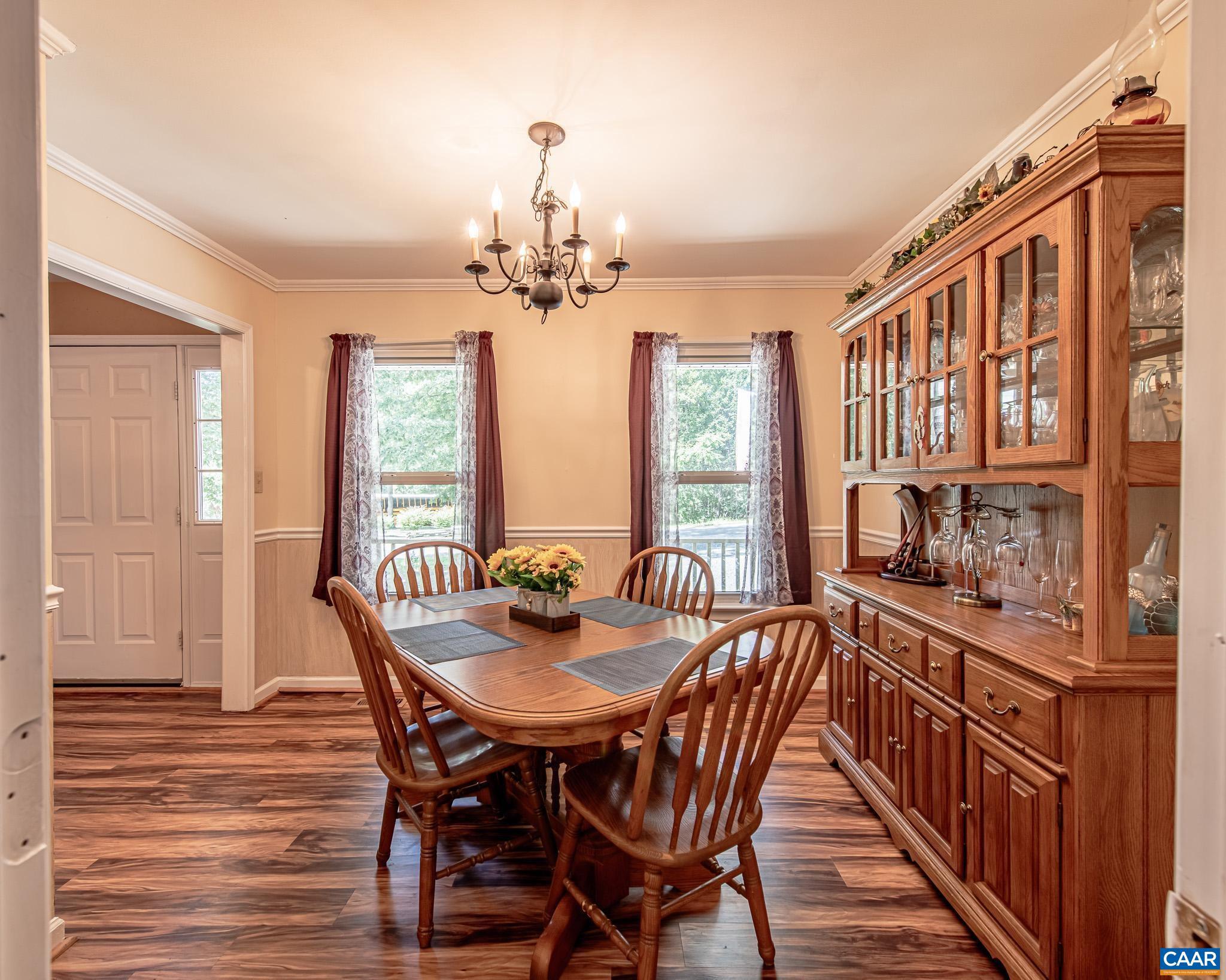 28276 Walnut Ridge Way Rhoadesville, VA 22542 - Photo 7 of 37 a view of a dining room with furniture window and wooden floor