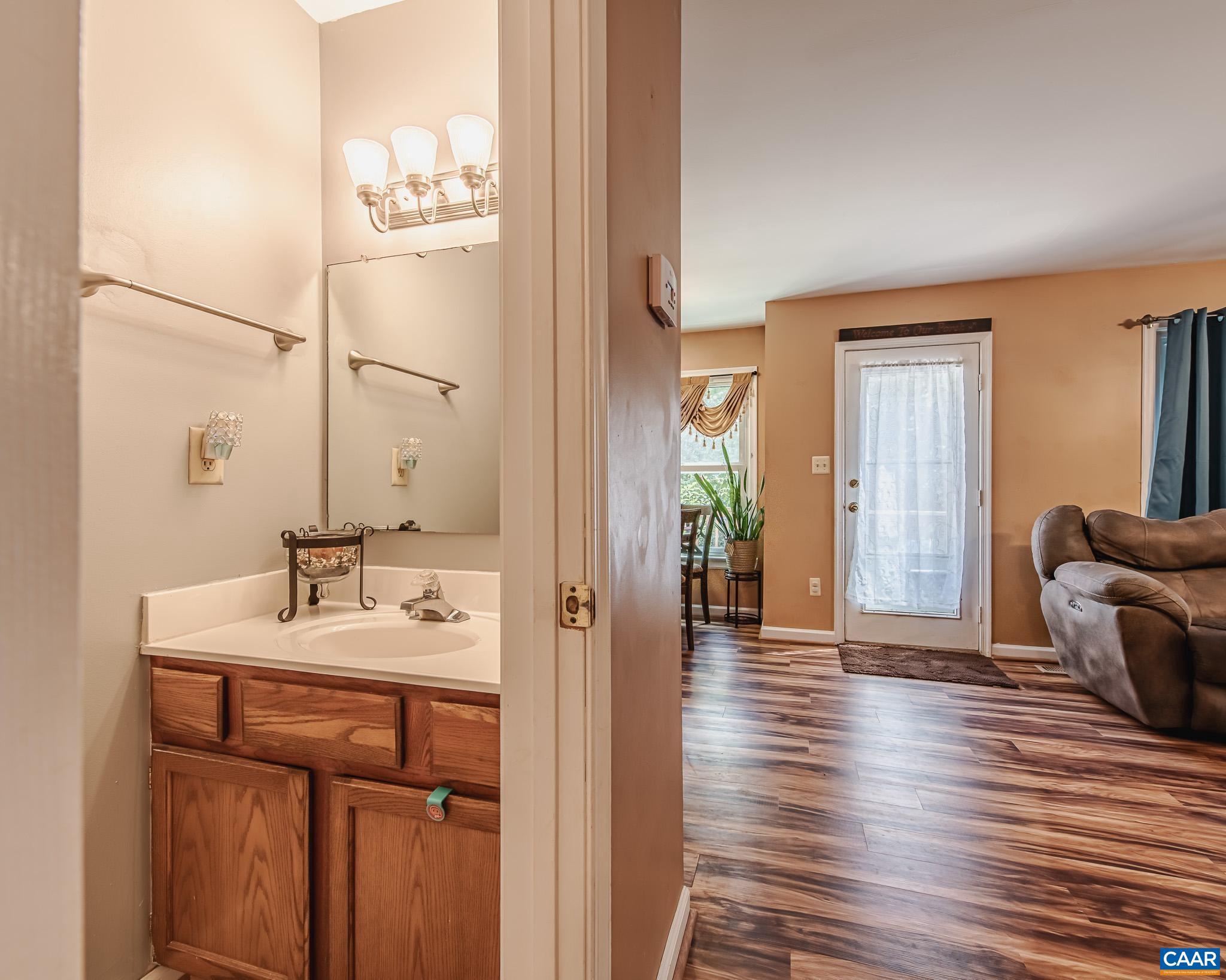 28276 Walnut Ridge Way Rhoadesville, VA 22542 - Photo 10 of 37 a bathroom with a sink and a mirror