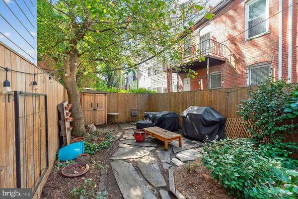 a backyard of a house with outdoor seating