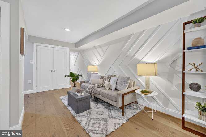 1450 Fairmont Street Northwest, Unit A Washington, DC 20009 - Photo 3 of 14 a living room with furniture and wooden floor