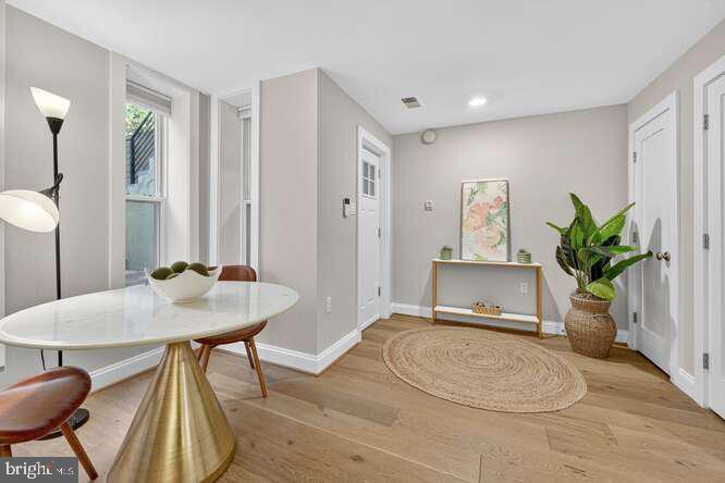 1450 Fairmont Street Northwest, Unit A Washington, DC 20009 - Photo 4 of 14 a workspace with furniture and window