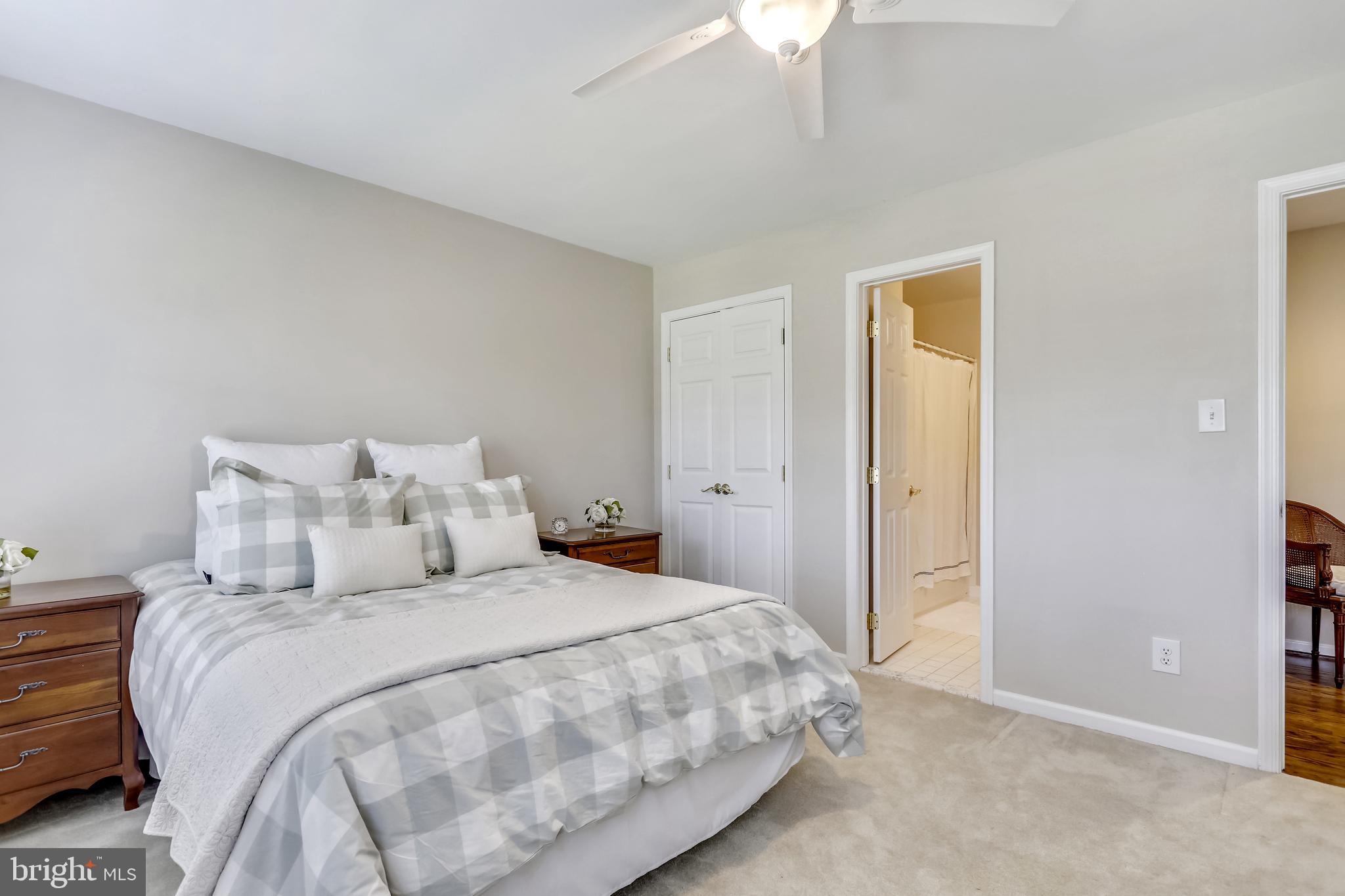 2113 Link Road Silver Spring, MD 20905 - Photo 32 of 78 a bedroom with a bed and a chandelier