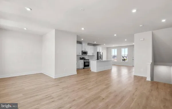 a view of kitchen with wooden floor