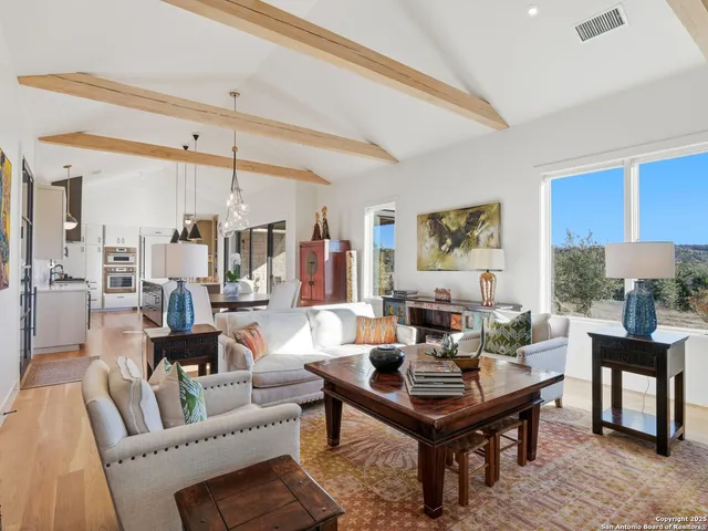 a bathroom with double vanity sink and a two mirror