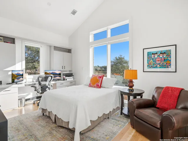 a bedroom with a bed and a table