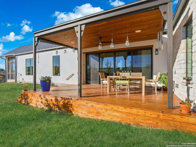 a view of an house with swimming pool yard fire pit and deck