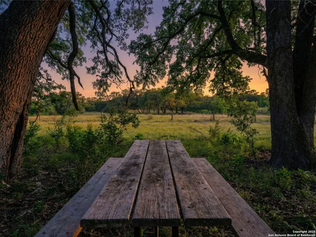 an aerial view of residential houses with outdoor space and swimming pool