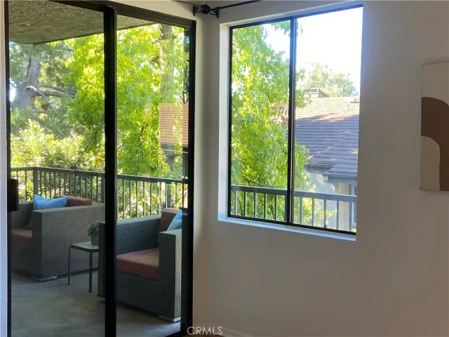 a living room with a window and a table