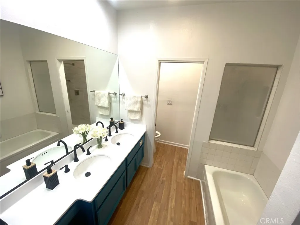 330 Cordova Street, Unit 261 Pasadena, CA 91101 - Photo 19 of 42 a spacious bathroom with a bathtub sink and mirror