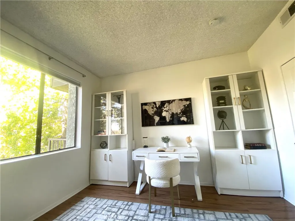 330 Cordova Street, Unit 261 Pasadena, CA 91101 - Photo 24 of 42 a living room with a large window and table