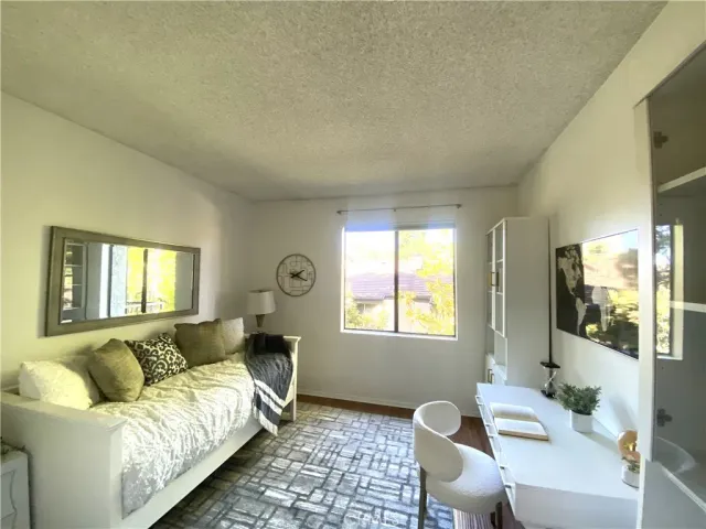 a kitchen with granite countertop a refrigerator and a sink