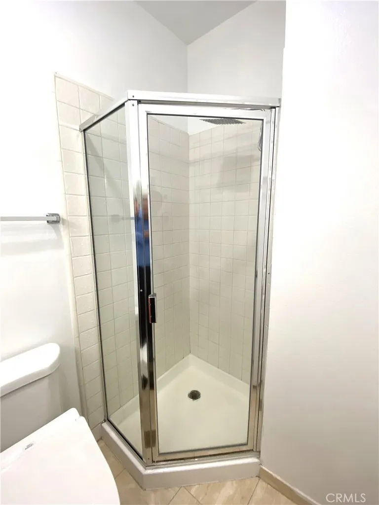 330 Cordova Street, Unit 261 Pasadena, CA 91101 - Photo 27 of 42 a bathroom with a glass shower door