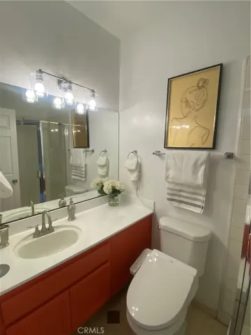 a kitchen with granite countertop a refrigerator and a sink