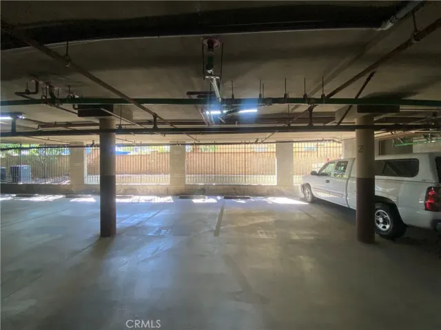 a view of a table and chairs under an umbrella