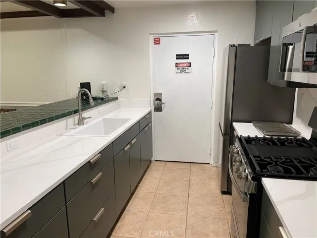 a room with pool table and wooden floor