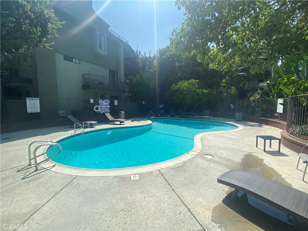 330 Cordova Street, Unit 261 Pasadena, CA 91101 - Photo 36 of 42 a view of a swimming pool with an outdoor space and seating area