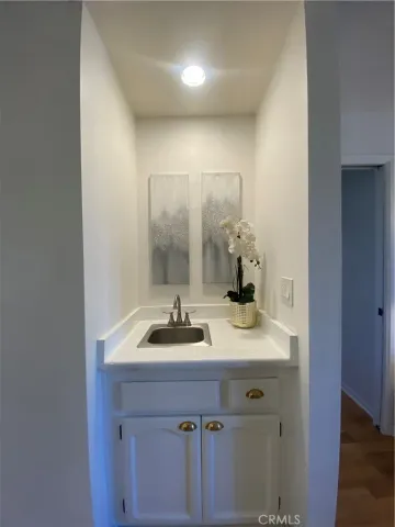 a bathroom with a table and a chair