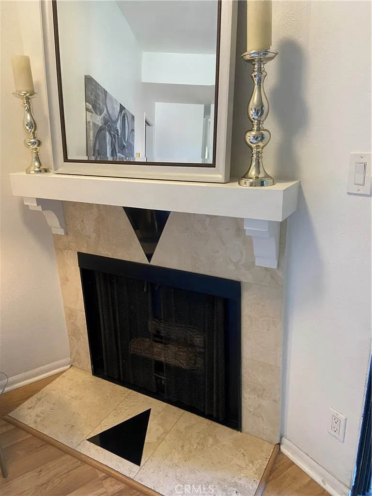 330 Cordova Street, Unit 261 Pasadena, CA 91101 - Photo 8 of 42 a living room with a fireplace