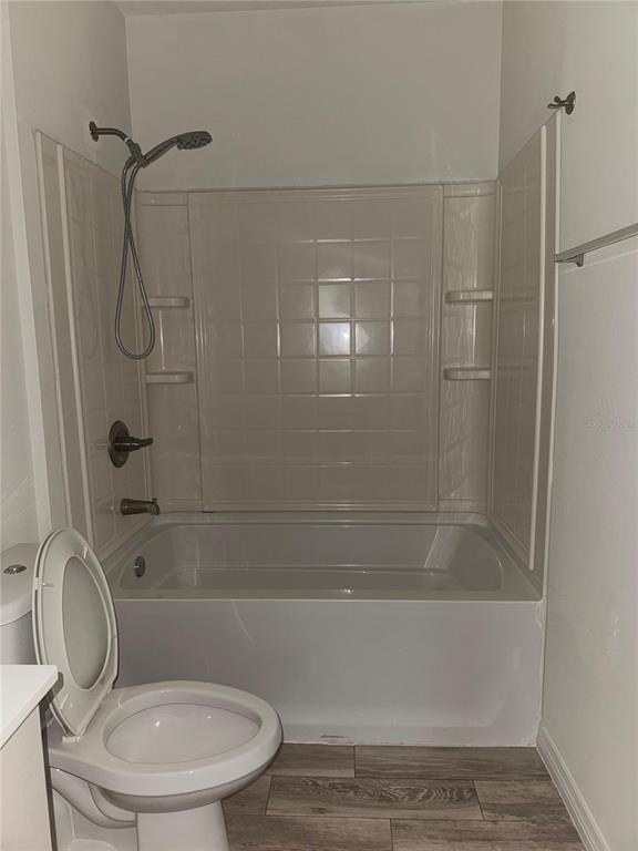 2121 McCoy Road, Unit 302 Orlando, FL 32809 - Photo 16 of 26 a bathroom with a toilet and shower