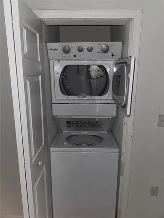 a kitchen with appliances a sink and cabinets