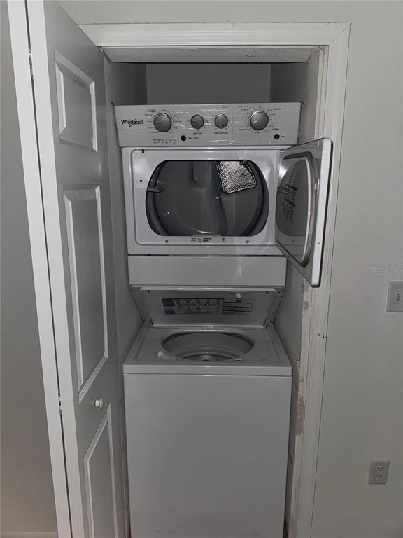 2121 McCoy Road, Unit 302 Orlando, FL 32809 - Photo 20 of 26 a utility room with dryer and washer