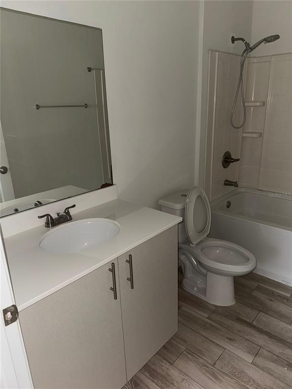 2121 McCoy Road, Unit 302 Orlando, FL 32809 - Photo 23 of 26 a bathroom with a sink toilet and shower