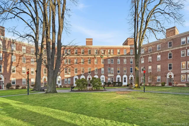a view of a building with a yard
