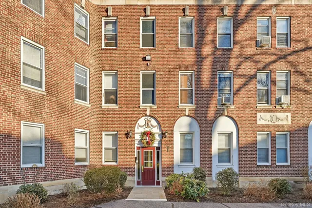 a front view of a multi story residential apartment building