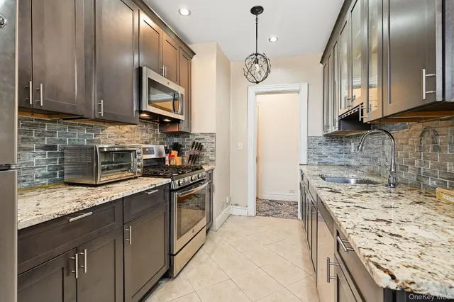 a bathroom with a sink vanity and a mirror
