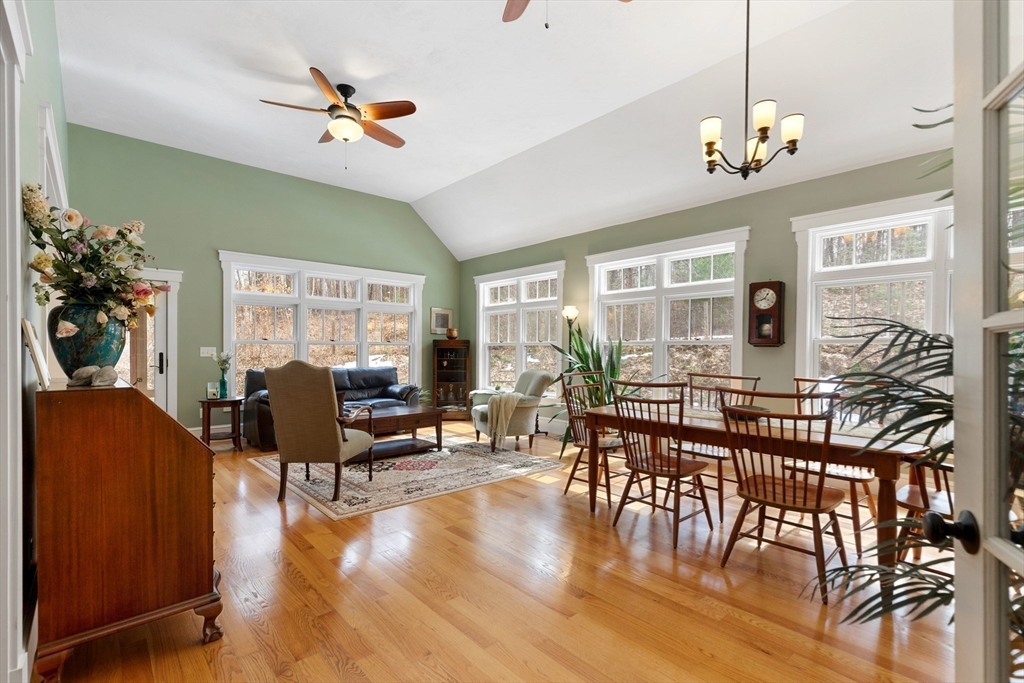 144 Brook Street Hudson, MA 01749 - Photo 11 of 44 a living room with furniture dining area and a chandelier