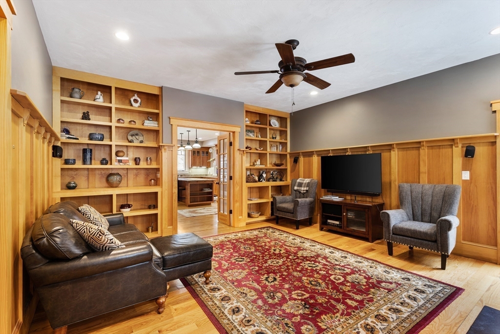144 Brook Street Hudson, MA 01749 - Photo 16 of 44 a living room with furniture and a flat screen tv